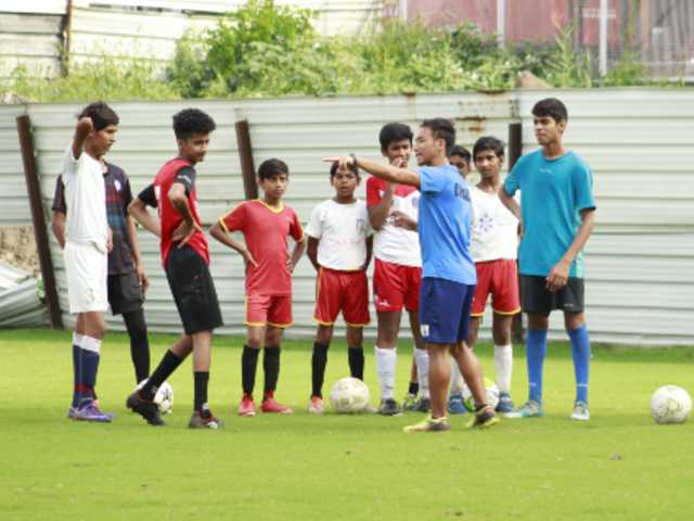 james tonsing coaching boys for football