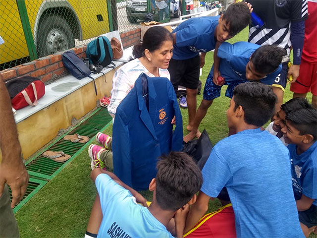 former India basketball player sushila saripalli with foundation boys